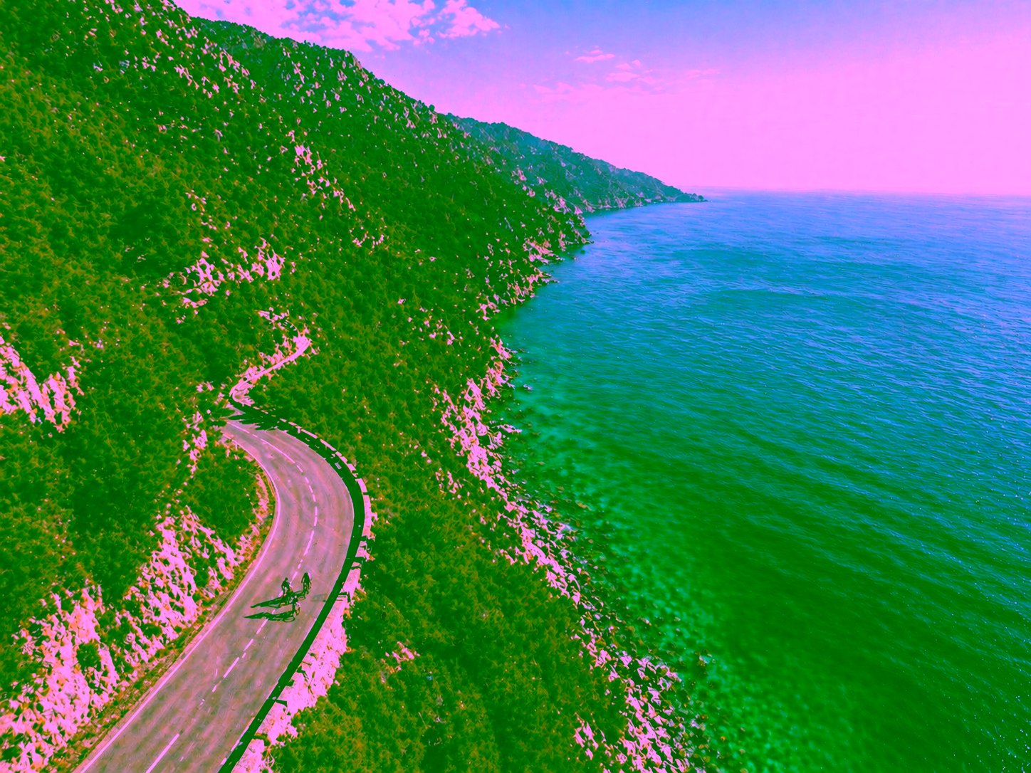 Curving roads wind like ribbons through the Mallorcan landscape, connecting nature with movement. Whether viewed from the ground or from the air, every perspective reveals the harmonious interplay of asphalt, rock, vegetation, and sea.