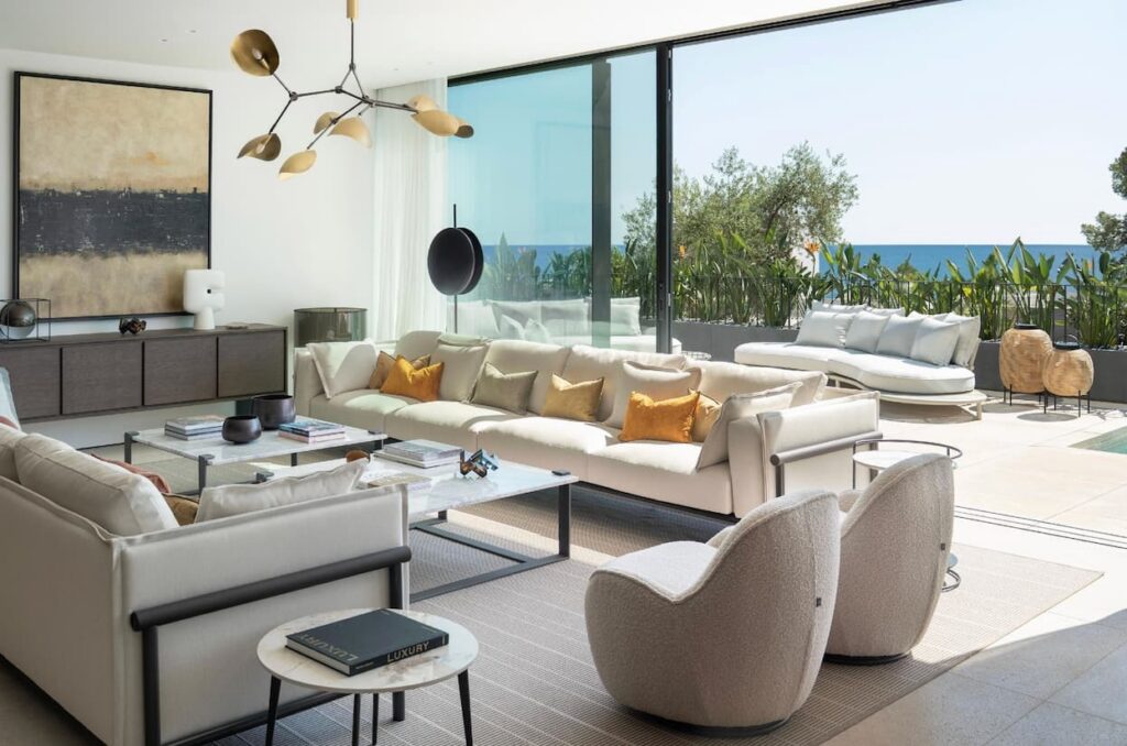 Modernly furnished living area with a sofa landscape and patio access.