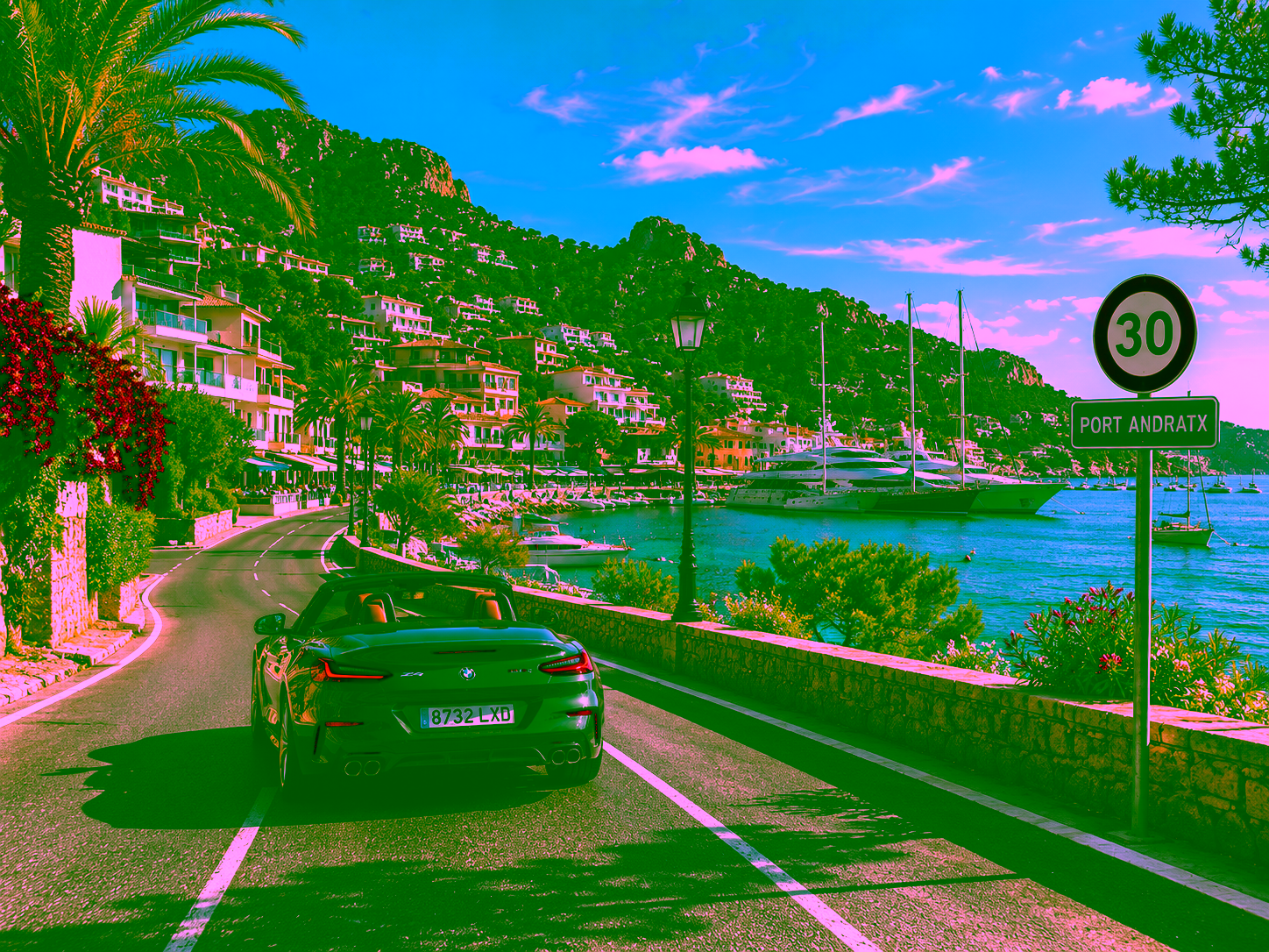 Street in Mallorca with car, traffic sign and Mediterranean landscape in the background 2